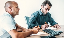 Ergo-Tec employees prepare the necessary documentation